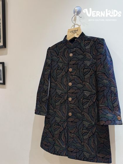 A closer look at our multi-hued Jodhpuri jacket. The intricate, colorful pattern adds a touch of modern artistry to a traditional silhouette, making it a standout piece for any festive event.