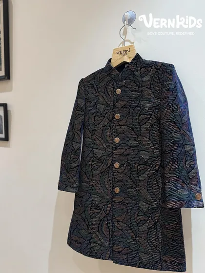 A closer look at our multi-hued Jodhpuri jacket. The intricate, colorful pattern adds a touch of modern artistry to a traditional silhouette, making it a standout piece for any festive event.