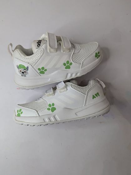 A finished pair from the Paw Patrol project, featuring Rocky and green paw prints.