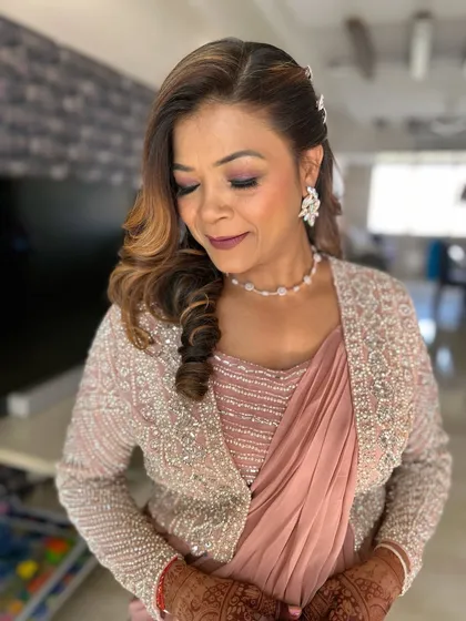 A beautiful makeover for the mother of the bride. The makeup is elegant and timeless, with a focus on glowing skin and softly defined eyes.