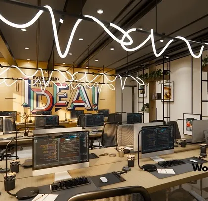 We believe a workspace should inspire creativity. For this IT office in Noida, we designed an open-plan workstation area with custom "IDEA" lighting to create a vibrant, high-energy environment that fosters collaboration and innovation.