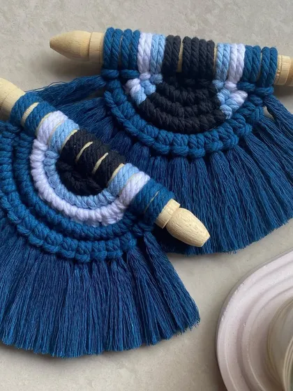 Protect your space with our macrame evil eye mini wall hangings. These pieces combine traditional symbolism with a modern bohemian aesthetic, handmade in shades of deep blue.