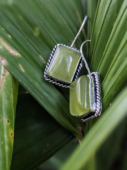 A different view of the mint green Monalisa stone earrings, showcasing their beautiful colour and the detailed rope design on the bezel.