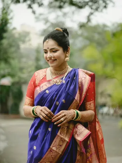 A beautiful, serene portrait of the bride, Sanika. We found a quiet path with lovely greenery, and she just looked so graceful and happy in her traditional Maharashtrian attire.