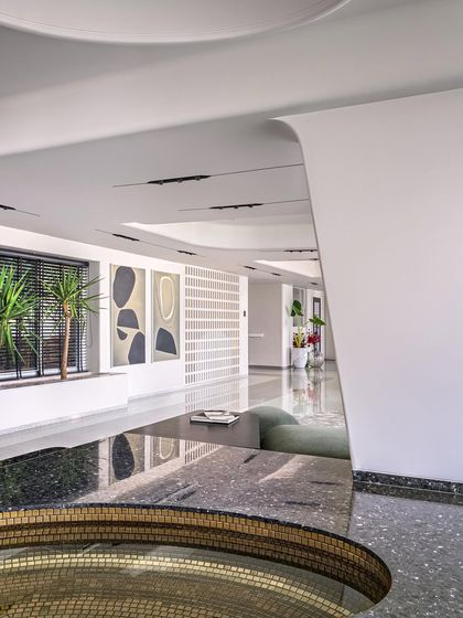 A detail of the hand-crafted mosaic pool in Apartment 56. The gold mosaic was skillfully applied by Rajasthani artisans on site, creating a shimmering, elliptical pool that serves as the focal point of the gallery-like space.