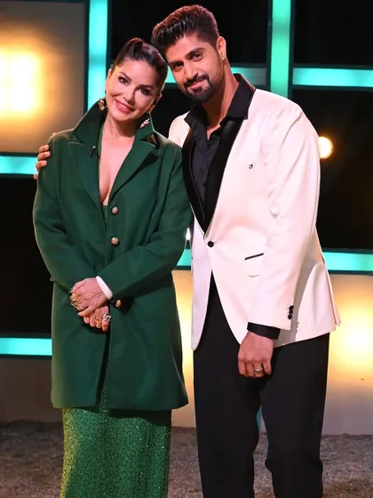Host Tanuj Virmani with the lovely Sunny Leone, looking dapper in our white tuxedo. A perfect look for the spotlight.