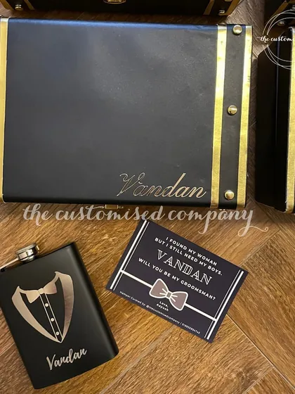 "Will you be my Groomsman?" Ask your boys with a gift they'll actually use. This set includes a personalized faux leather trunk and a custom-engraved hip flask.