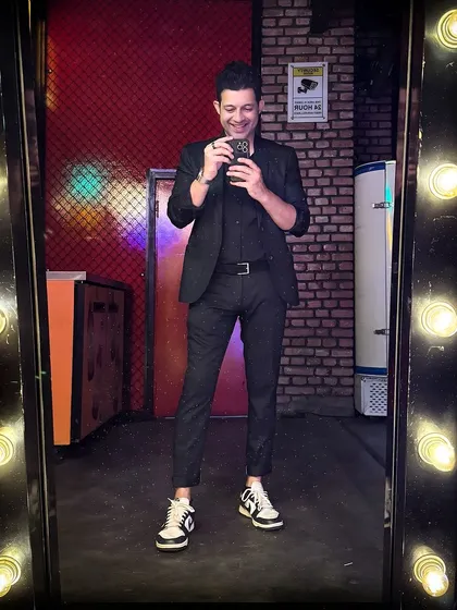 A quick mirror selfie before a gig. Dressed up and ready to bring the party, whether it's a Wednesday karaoke or a Saturday DJ set.