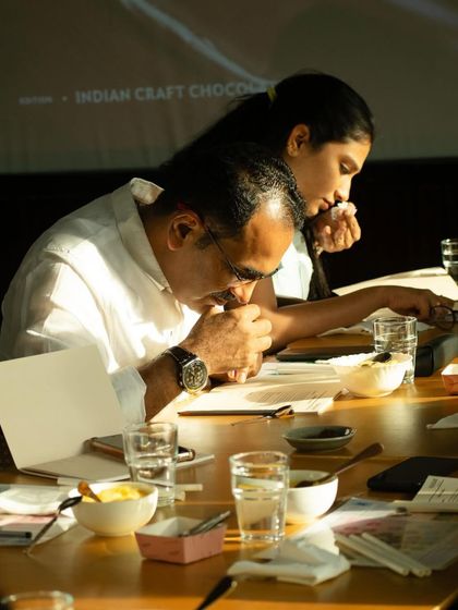 The "chocolate meditation" in practice. Participants in our workshop take a moment to deeply inhale the aroma of the chocolate, a technique used by professional tasters to fully appreciate its complex bouquet before tasting.