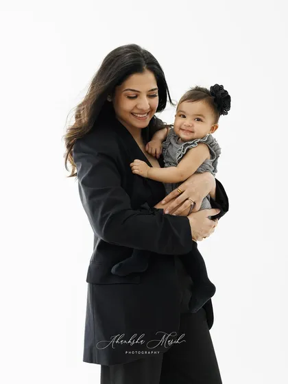 A duplicate image, this pose remains a perfect example of capturing a genuine, happy moment between a mother and her baby.