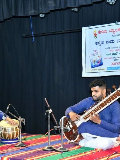 A full stage view of a classic sitar and tabla duet. This setup is perfect for audiences who appreciate the purity of traditional Indian music.