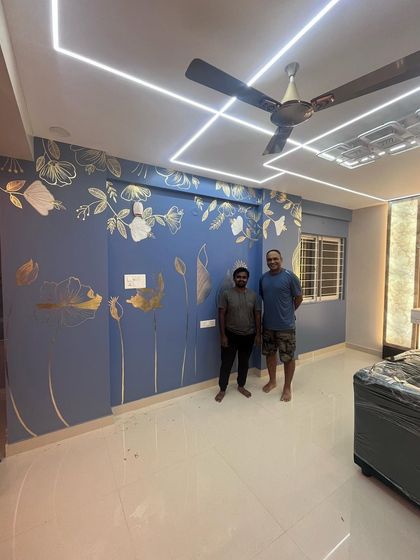 Standing with a happy client next to the finished gold foil mural. It’s always my goal to bring this level of beauty and satisfaction to every project.