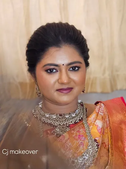A close-up of this bride's soft and graceful makeup. The dewy base and romantic eye makeup make her look ethereal.