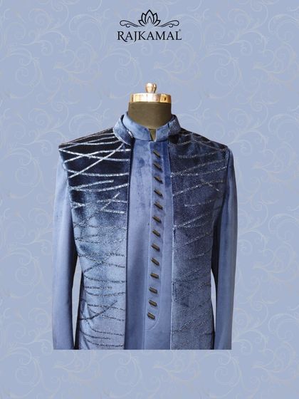 Another view of the midnight blue velvet jacket, showcasing its distinctive bandhgala collar and layered style.