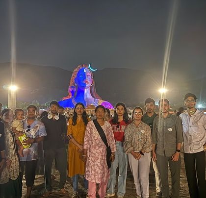The group in front of the magnificent Adiyogi statue at night. The light show is a spectacular sight to behold.