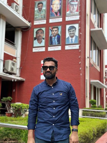 In front of a building at Punjab University, a place that shaped my early thoughts. Life can be an enigma, like a madman's dream.