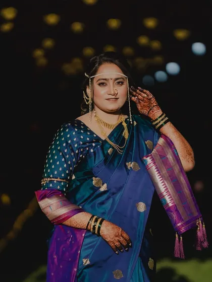 A beautiful night-time portrait of the bride, her features softly illuminated.