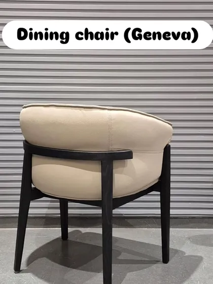 The back view of the 'Geneva' chair shows the elegant curve and the way the black frame provides a subtle contrast.