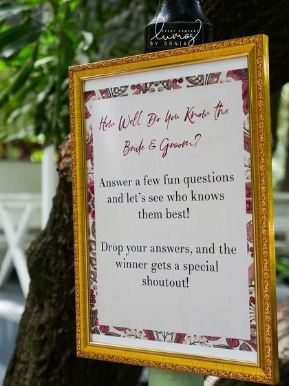 A "How Well Do You Know the Bride & Groom?" game sign, adding a fun and interactive element for guests at the wedding.