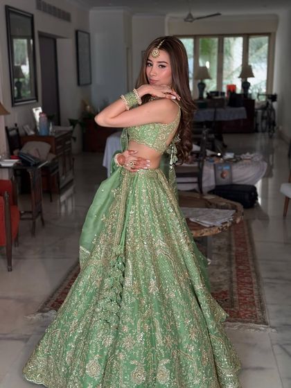 A playful and confident pose that captures the fun and celebratory spirit of a wedding event.