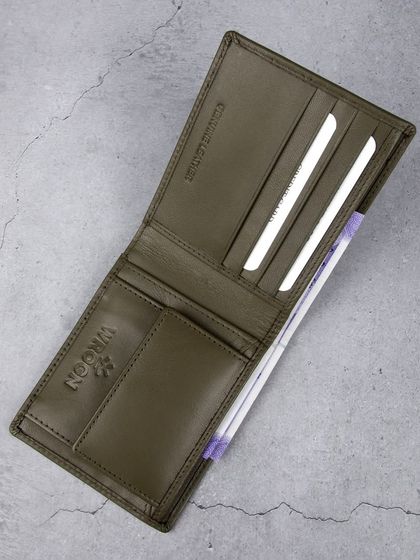 An overhead shot of the open olive green wallet.