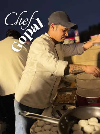 Chef Gopal is focused on preparing dumplings at a live station. He is a key part of our team that handles Asian cuisine for our catering events.