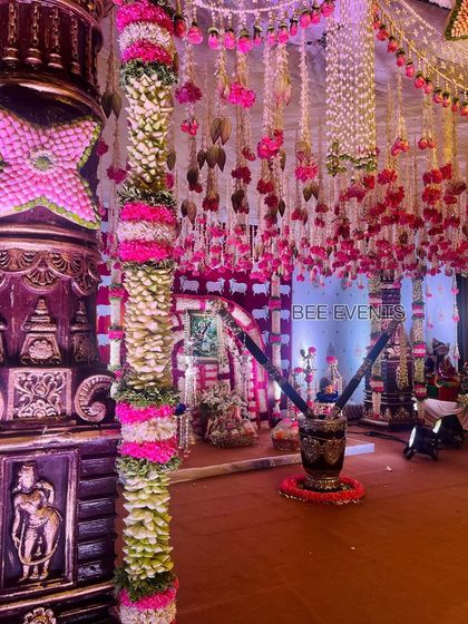 A close-up shot of the intricate floral decorations on the traditional wedding mantap. The pillars are adorned with beautiful flower arrangements, showcasing our attention to detail.