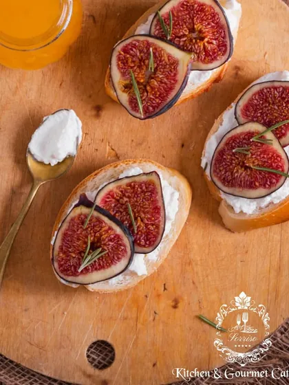 A beautifully composed shot of my Fresh Fig Crostini. Creamy goat cheese on toasted bread, topped with sweet, ripe figs and a sprig of rosemary for an elegant appetizer.