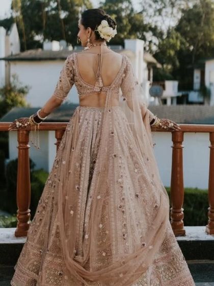 Another shot of the bride's stunning back profile and floral bun, overlooking the beautiful resort.