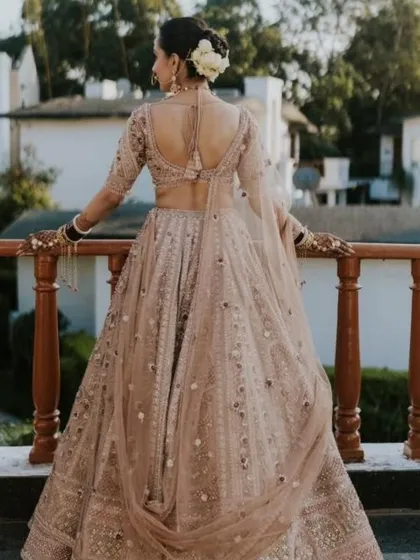 Another shot of the bride's stunning back profile and floral bun, overlooking the beautiful resort.
