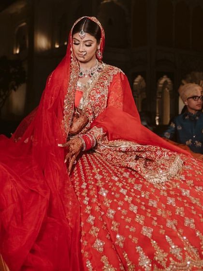 A stunning portrait of the bride in her vintage car, looking every bit the modern maharani. I focus on creating these iconic, high-impact moments.