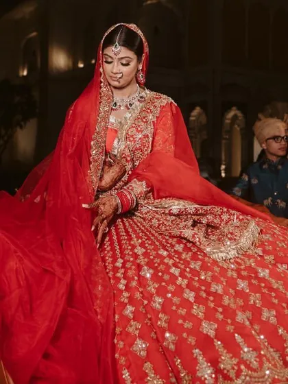 A stunning portrait of the bride in her vintage car, looking every bit the modern maharani. I focus on creating these iconic, high-impact moments.