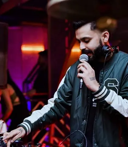 Hyping up the crowd on the mic. It's one of my favorite parts of the job, making sure everyone feels like they're part of the show.