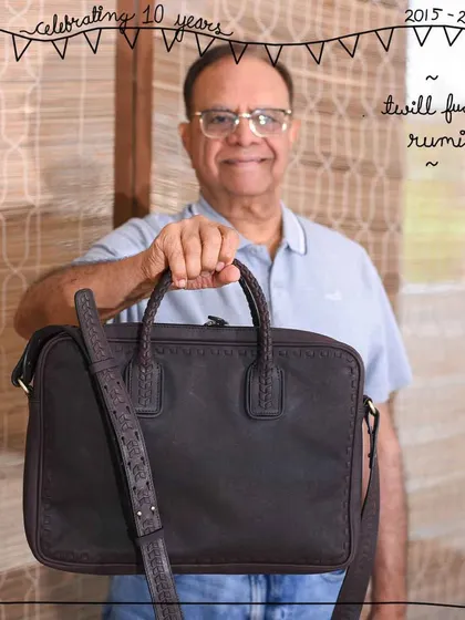 Our Rumi briefcase is for the modern professional who values both style and function. Shown here in a classic Twill Fudge leather, it’s a structured, lightweight laptop bag that’s perfect for work and travel. We were asked for a men's line for years, and Rumi was our first answer.