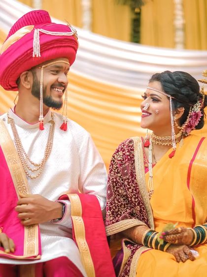 A classic portrait of the bride and groom looking at each other, their smiles reflecting the joy of the moment. This is a timeless shot that every couple treasures.