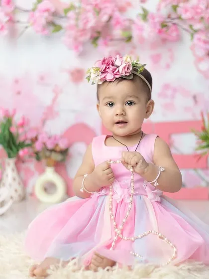 A princess in a garden of pink blossoms. This floral theme is incredibly popular and creates such a soft, romantic feel.