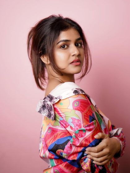 A profile shot from a colorful studio session, highlighting the model's features and the fun styling.