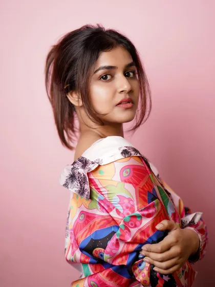 A profile shot from a colorful studio session, highlighting the model's features and the fun styling.