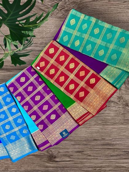An assortment of our colorful half-and-half pure Mysore crepe silk sarees, showcasing the variety of combinations available.
