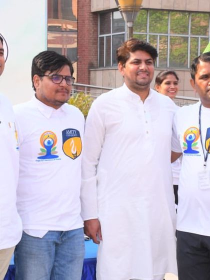 Posing with enthusiastic participants after a successful corporate yoga event. Building a connection with the employees and seeing their positive energy is the most rewarding part of these large-scale sessions.