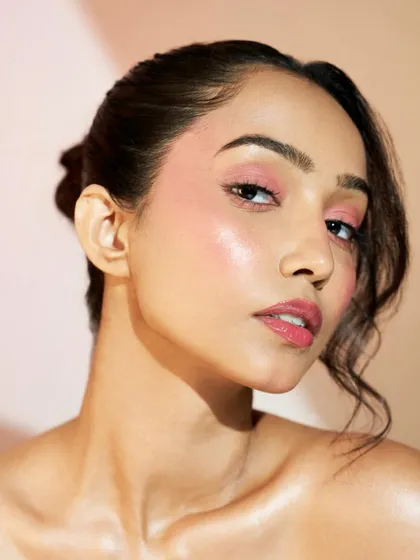 The way the light hits the cheekbone in this shot is perfection. This is the result of careful layering of cream and powder products to create a lasting, dewy glow.