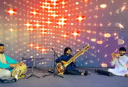 A sitar, tabla, and flute trio creating a captivating soundscape for a corporate event. This trio format is versatile, fitting both energetic and mellow moments within a single evening.