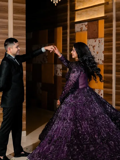 Not just a portrait, but a reflection of grace and love. This shot captures the elegance of the couple and the beautiful movement of the bride's gown, creating a fairytale moment.