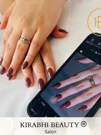 Here you can see how I can perfectly match a color from an inspiration photo. We found the exact shade of maroon this client wanted for her chic, solid-color manicure.