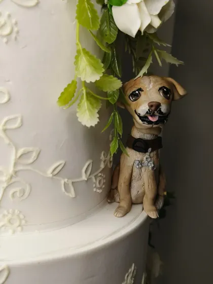 A close-up of one of the dog figurines from the wedding cake. Capturing a pet's likeness and personality in fondant is a special challenge I absolutely love. Look at that little mustache!