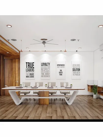 The conference room at SVG Exports was designed to be a clean, sophisticated, and inspiring space for collaboration. A custom V-shaped conference table anchors the room, complemented by minimalist decor, motivational wall art, and warm wood flooring, reflecting a modern and forward-thinking corporate culture.