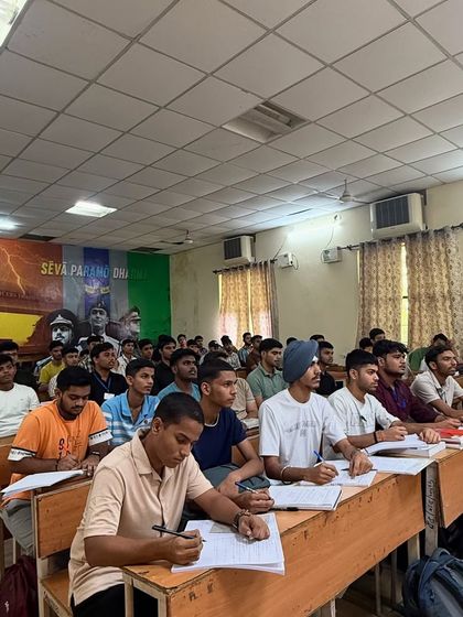 Another view of our focused learning environment. The wall mural, 'Seva Paramo Dharma', serves as a constant reminder of our ultimate goal.