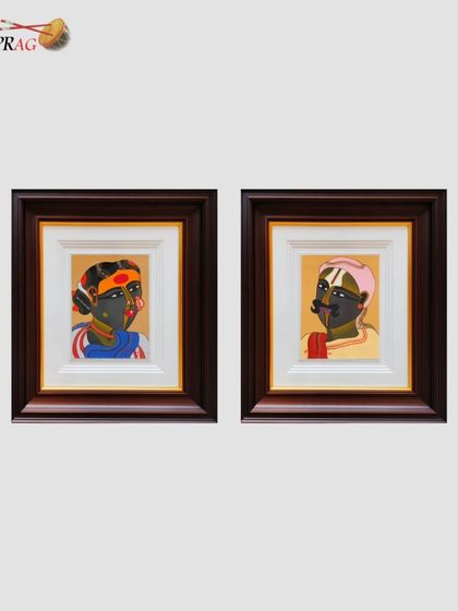 This pair of smaller zardozi portraits is framed individually but designed as a diptych. The matching dark wood frames with gold inlay create a cohesive and elegant presentation, perfect for displaying as a set.