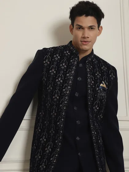 For a Roka or Sagai, this navy blue kurta with a long embroidered jacket is a perfect choice. It's a comfortable yet stylish look that works for any celebration.