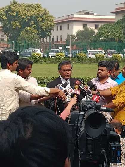 Surrounded by press and cameras outside the Supreme Court, a common occurrence when handling cases of national interest.